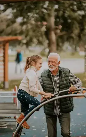 grandfather-spending-time-with-his-granddaughter-park-playground-autumn-day_small